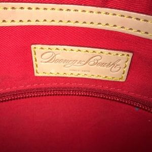 Dooney and Burk purse still have tags on it.